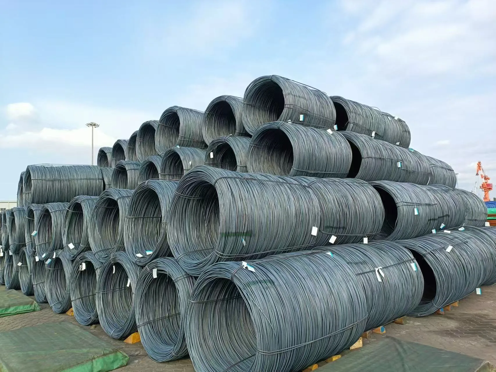 Wire rods stacked together, displaying uniform dimensions and finish